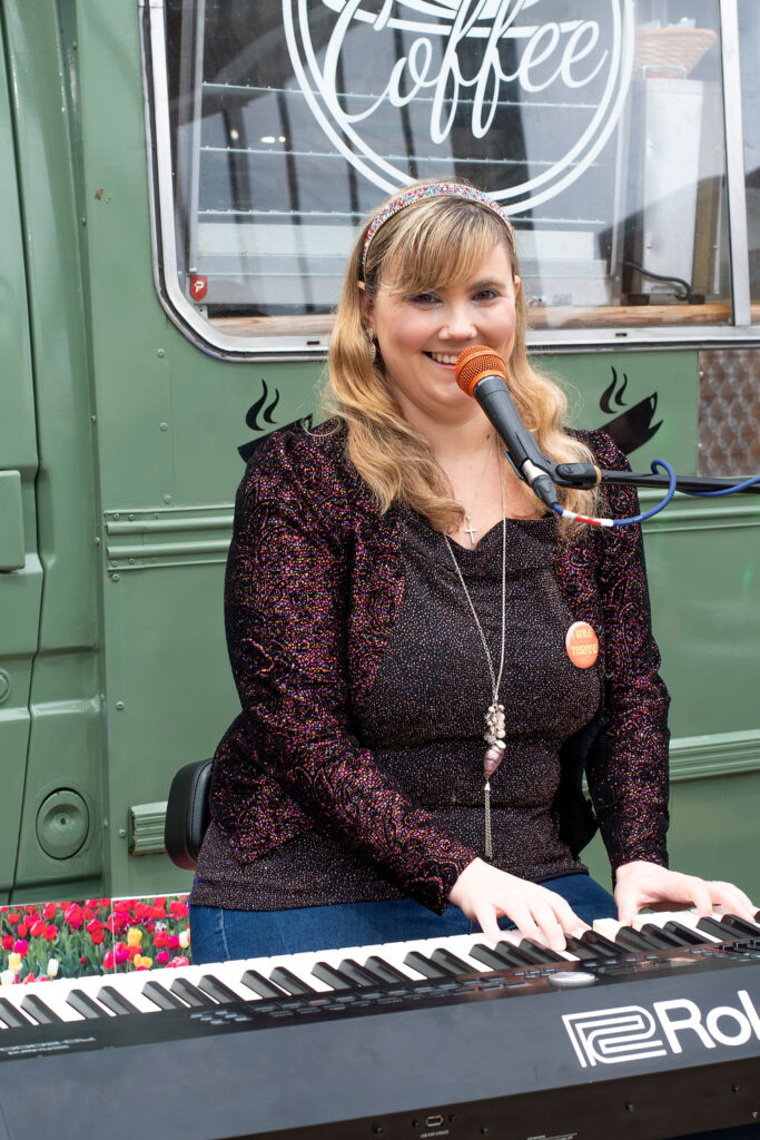 Photo showing Beth Merrill Neurodivergent AuDHD Singer Songwriter Musician with Music With Meaning CIC